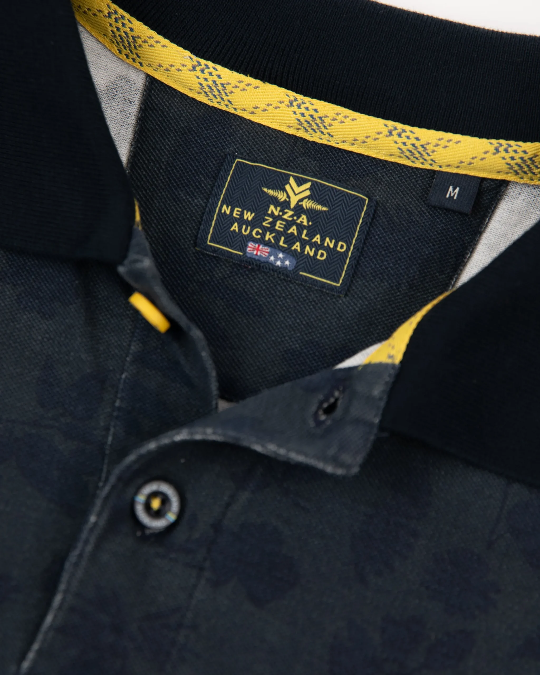 NZA New Zealand Auckland Donkerblauwe polo met bladprint