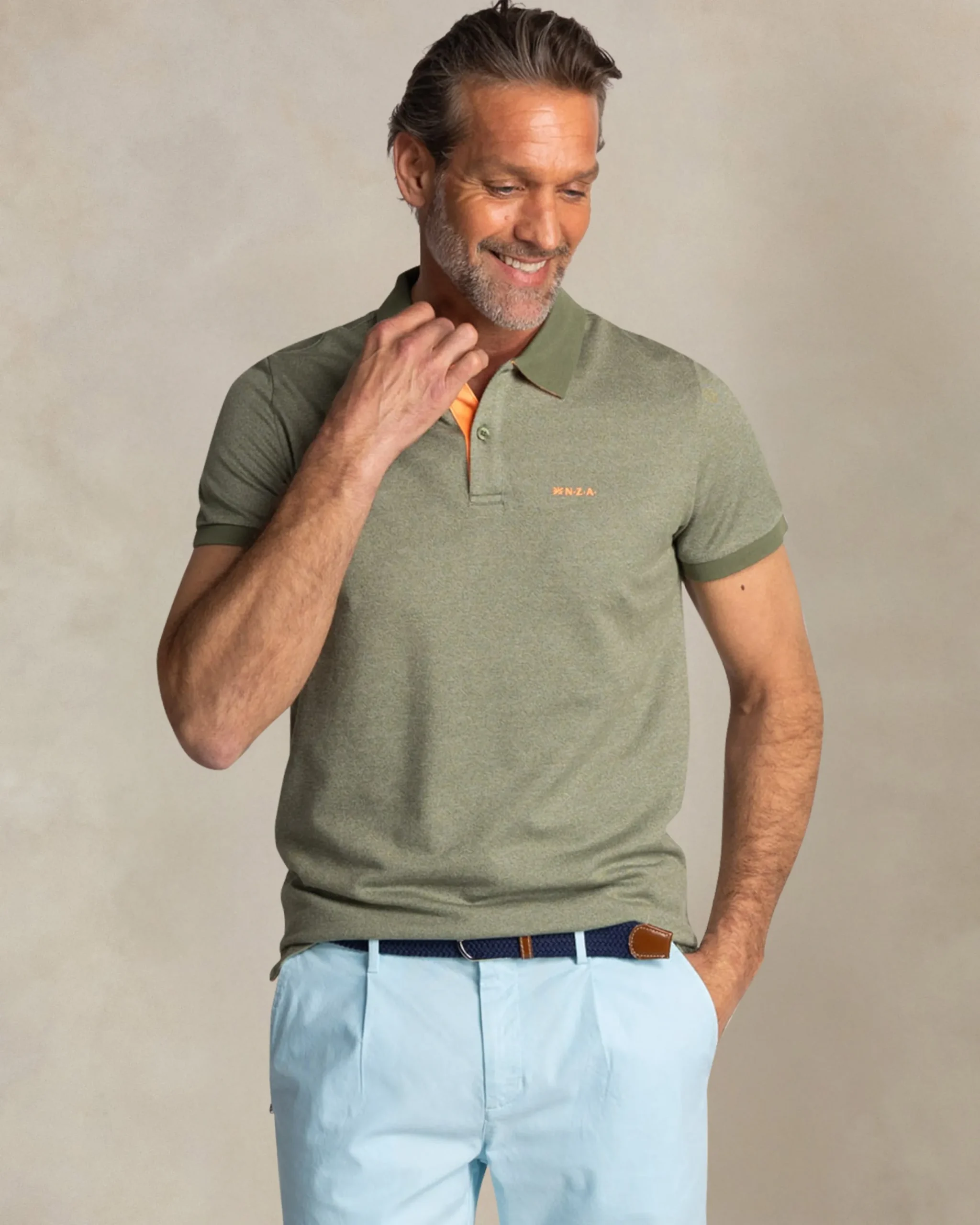 NZA New Zealand Auckland Effen groene polo met oranje details