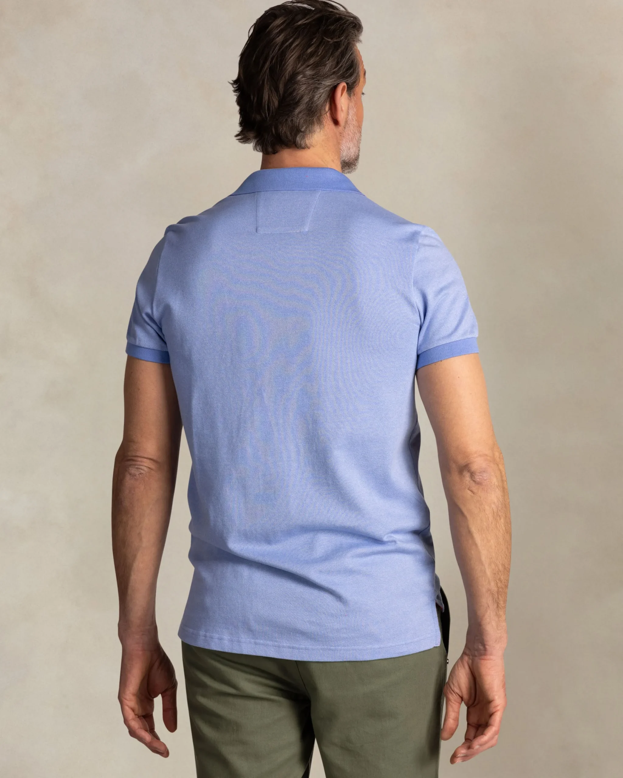 NZA New Zealand Auckland Effen lichtblauwe polo met oranje details