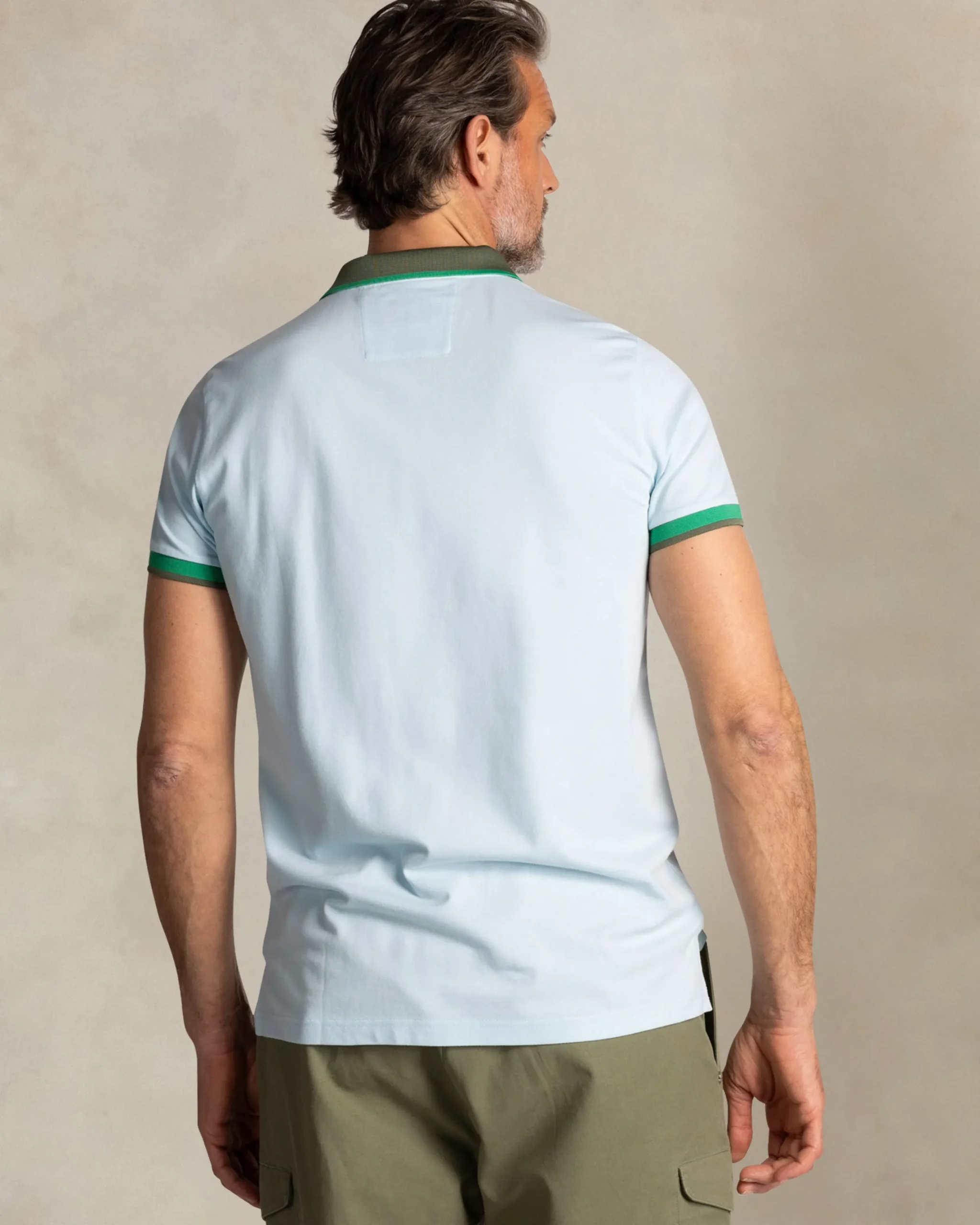 NZA New Zealand Auckland Lichtblauwe katoenen polo met groene kraag