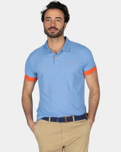 NZA New Zealand Auckland Lichtblauwe polo met oranje accenten