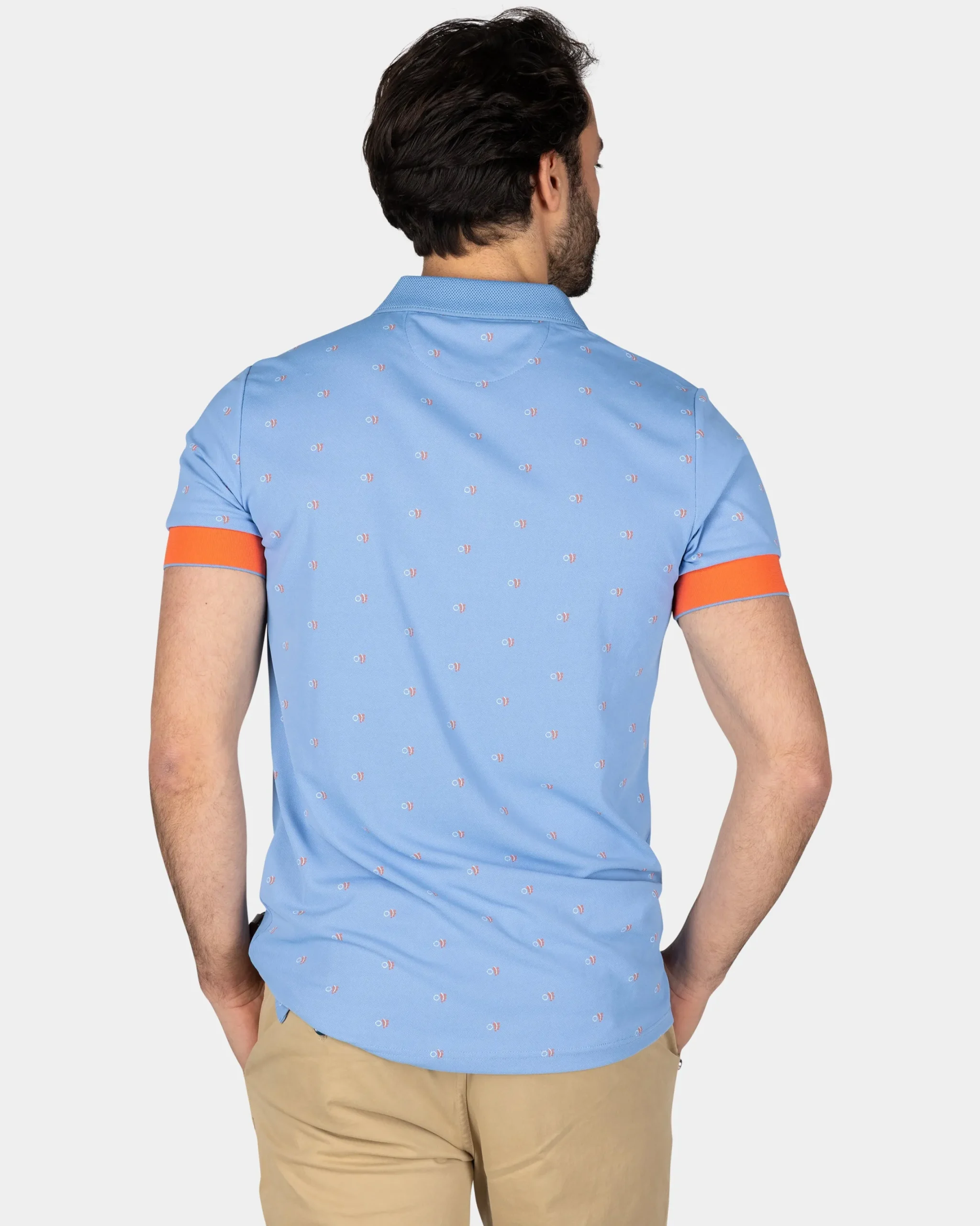 NZA New Zealand Auckland Lichtblauwe polo met oranje accenten