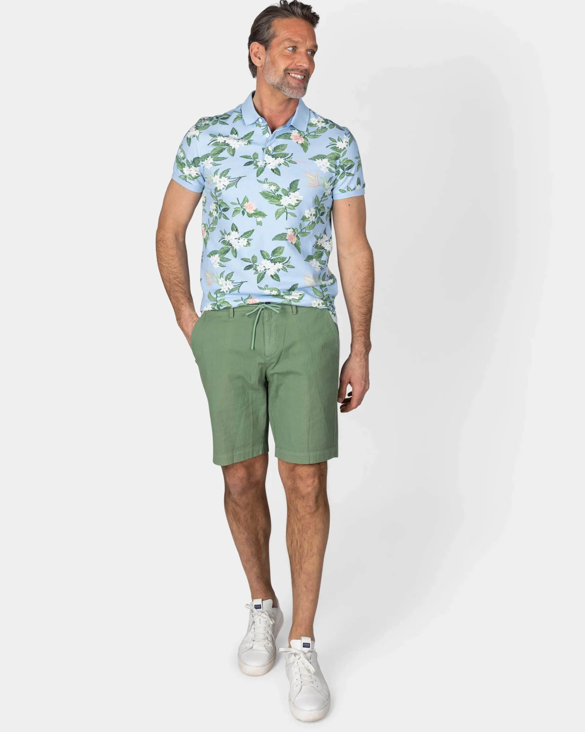 NZA New Zealand Auckland Pastelblauwe polo met grote bloemenprint